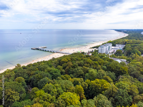 Aerial view landscape, view of Baltic sea in Poland, clean beach, forest and trees, horizon.