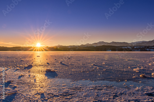 Frozen Lake with Ice Floes in Winter Landscape during Sunrise  Bavaria  Germany  Europe