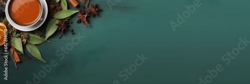 Herbal tea on dark teal background, writing space