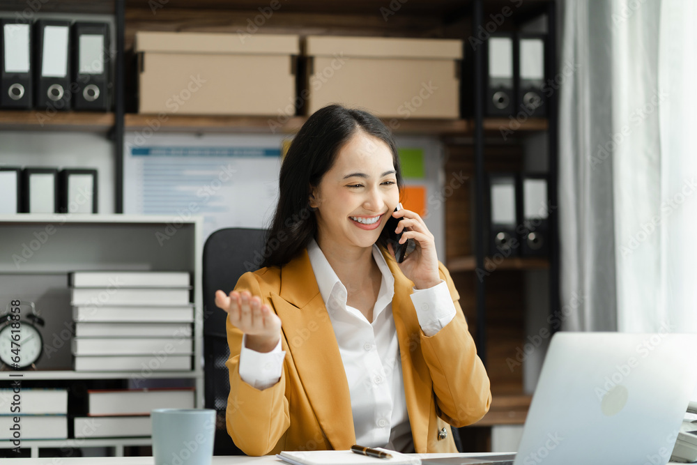 Business women talk mobile phones and working on laptop computers, online business, work from home, teleworking concept. Business women talk mobile phones and working on laptop computers, online business, work from home, teleworking concept.