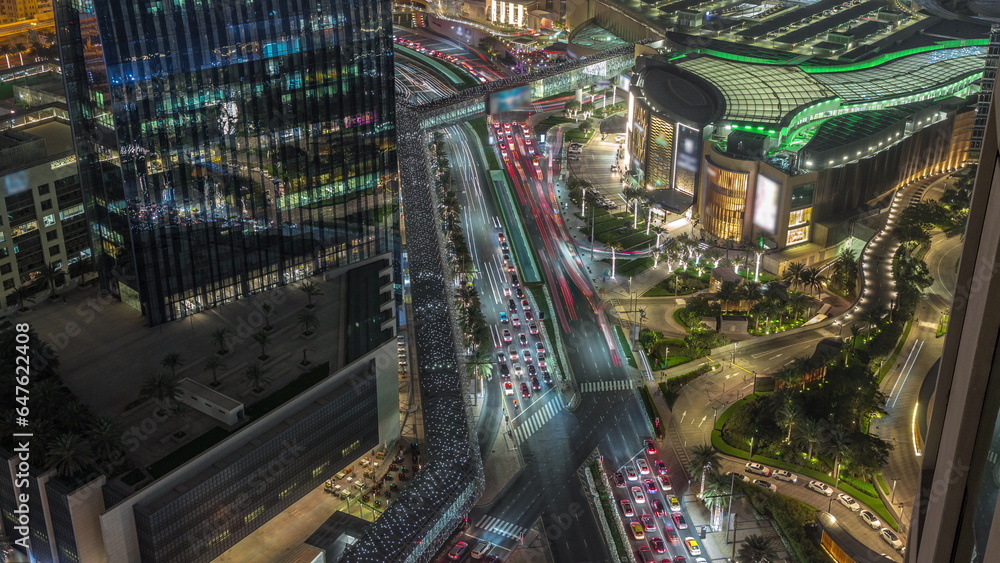Aerial panorama of Downtown Dubai with shopping mall and traffic on a street day to night timelapse from above, UAE Aerial panorama of Downtown Dubai with shopping mall and traffic on a street day to night timelapse from above, UAE