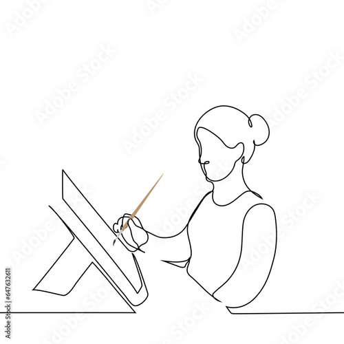 woman with a brush sits at the table with an art easel with a canvas or sheet of paper - one line art vector. concept female artist, art therapy, drawing master class