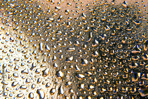 Drops of water on a colored background. Abstract texture