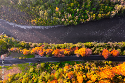 Mountain Majesty: Aerial View of River, Road, and Fall Foliage