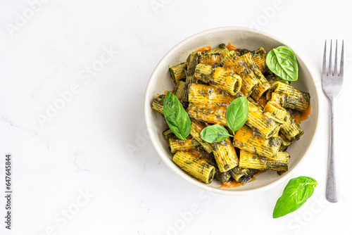 Pesto Rigatoni Pasta on White Background Top Down Photo