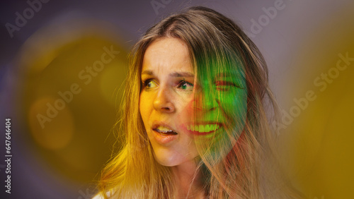 bipolar disorder people emotion mental woman. Close-up photo of a young beautiful sad woman suffering from multiple personality disorders. photo