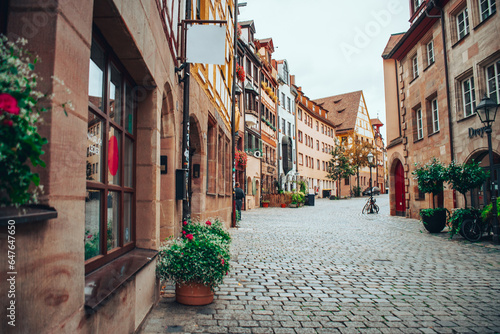 Beautiful curved cobblestone street - Weissgerbergasse in Nuremberg, Germany photo