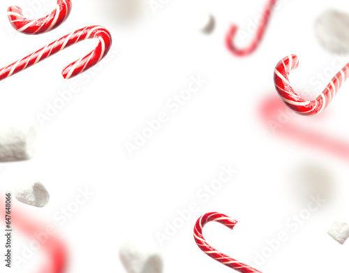 Cut out flying traditional Christmas candy cane, lollipop, white marshmallows isolated on white background. With clipping path. Creative new year food mockup. Festive decor, Christmas holiday symbol