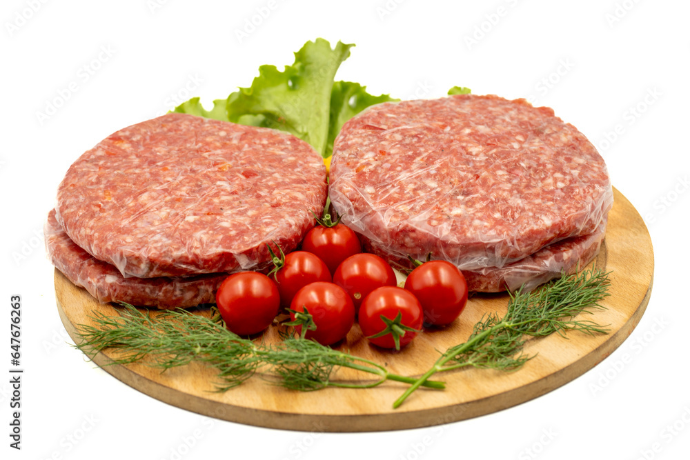 Raw hamburger patty isolated on white background. Raw veal hamburger patties with herbs and spices Raw hamburger patty isolated on white background. Raw veal hamburger patties with herbs and spices