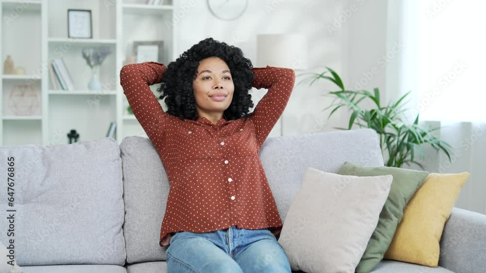 Young african american female relaxing with her eyes closed and her ...
