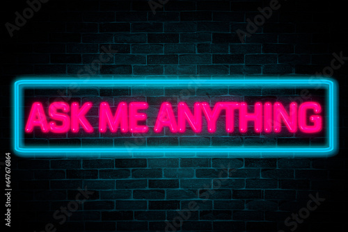 Ask me anything neon banner on brick wall background.