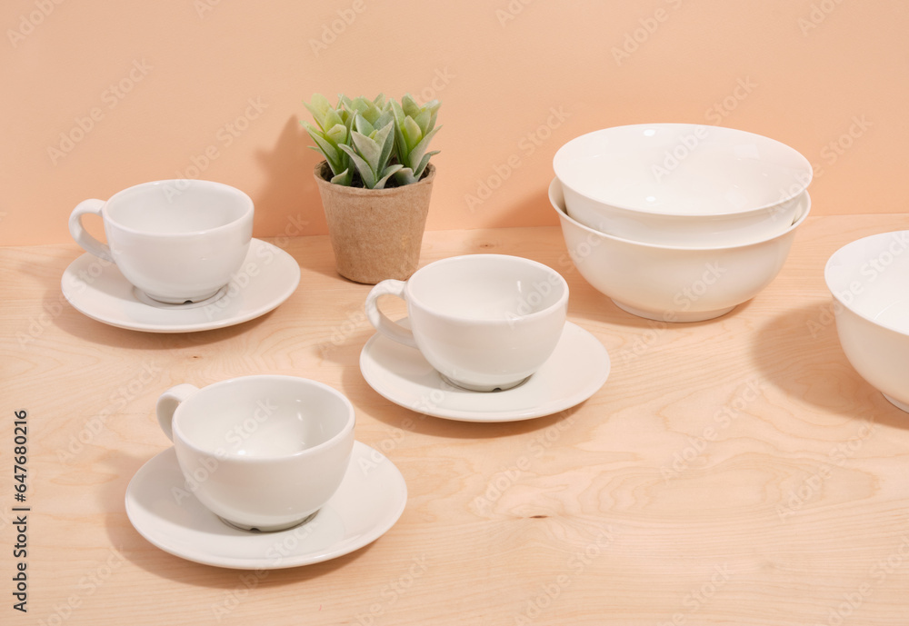 Fototapeta premium Set of white minimal tableware. Ceramic crockery. Beautiful table setting.