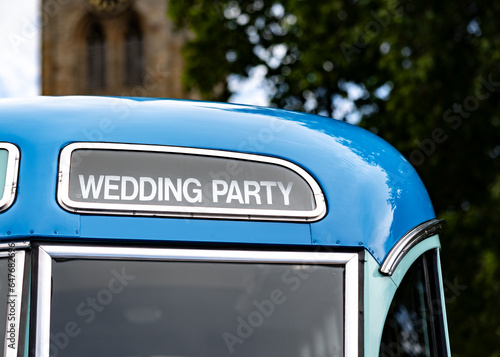 Wedding party bus coach transportation blue old vehicle to transport guests to church