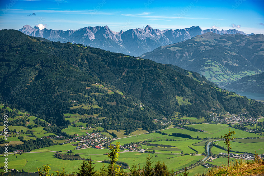 Obraz premium aerial view of the Salzach valley with the villages Kaprun and Niedernsill as well as the mountain range of the socalled Steinernes Meer (stony sea) in the background, Austria