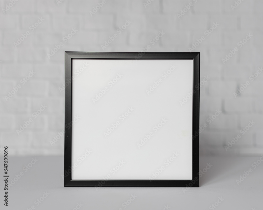 Minimal wooden picture poster frame mockup on white wallpaper Minimal wooden picture poster frame mockup on white wallpaper