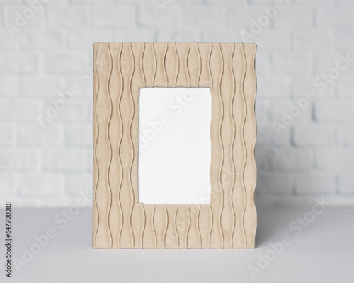 Minimal wooden picture poster frame mockup on white wallpaper