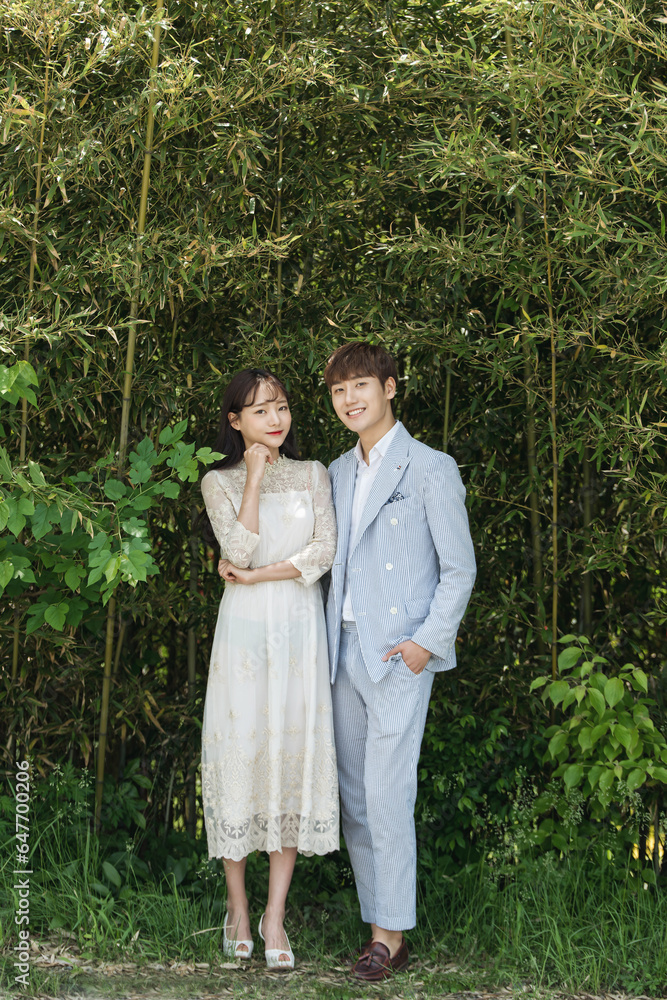 A loving couple is taking wedding photos outdoors for their wedding. A loving couple is taking wedding photos outdoors for their wedding.