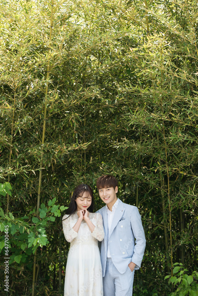 A loving couple is taking wedding photos outdoors for their wedding. A loving couple is taking wedding photos outdoors for their wedding.