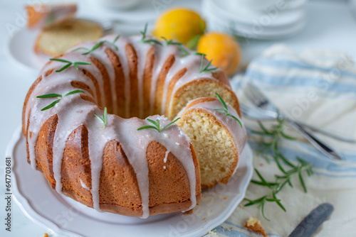 Lemon bundt cake drizzled with powdered sugar glaze