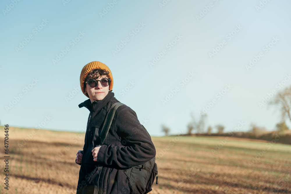 Traveler alternative girl in nature in front of a relaxing landscape with blue sky. copy space. horizontal Traveler alternative girl in nature in front of a relaxing landscape with blue sky. copy space. horizontal