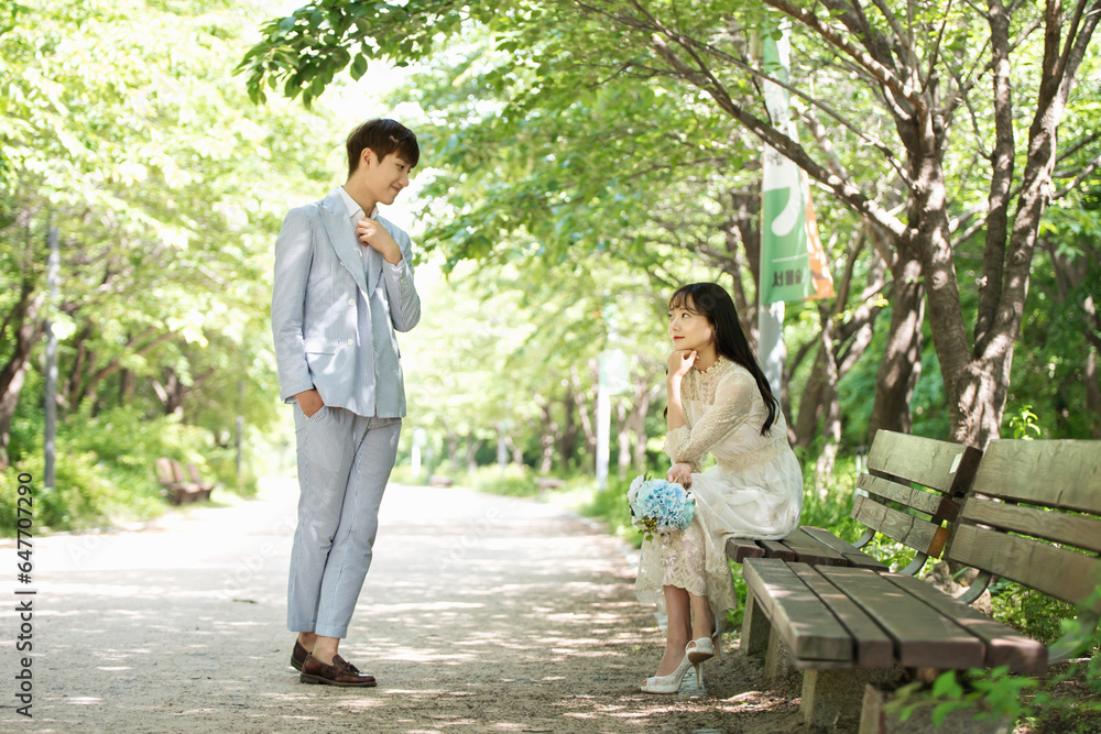 A loving couple is taking wedding photos outdoors for their wedding. A loving couple is taking wedding photos outdoors for their wedding.