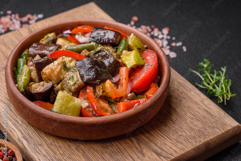 Delicious fresh salad of grilled vegetables peppers, tomatoes, eggplants and zucchini Delicious fresh salad of grilled vegetables peppers, tomatoes, eggplants and zucchini