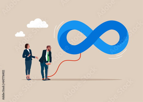 Businessman pumps up a balloon of a ending infinity loop shape floats higher. Business cycle, impossible illusion.