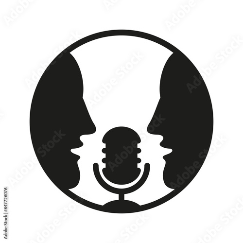 Two men talking into a microphone.