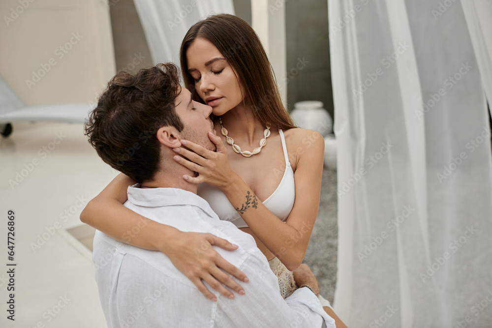 couple harmony, tattooed woman touching face of boyfriend during their romantic getaway, vacation couple harmony, tattooed woman touching face of boyfriend during their romantic getaway, vacation