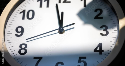 Clock face time lapse. Clock time ticking on a classic Wall Clock. Shadows moving over the Watch. Darkness and light games on the clock face. Concept footage apocalyptic mood moving time pointer