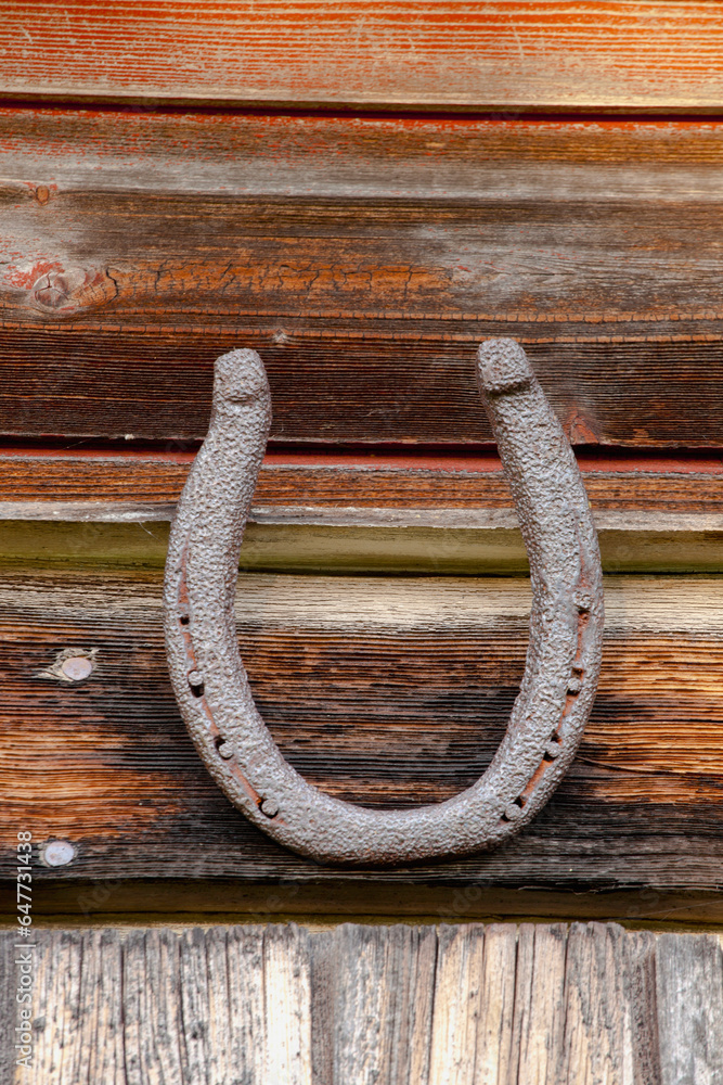 A Horseshoe Mounted On A Wooden Wall; Iron Hill, Quebec, Canada A Horseshoe Mounted On A Wooden Wall; Iron Hill, Quebec, Canada