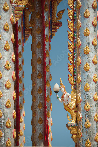 Ornate Temple Pillars; Prachuap Kiri Khan, Prachuap Province, Thailand photo