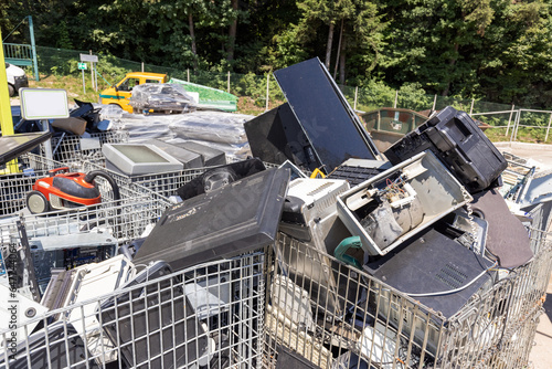 Electrical and electronic waste disposed of in a recycling center, close up shot. E-waste, repair, reduce, recycle concept.