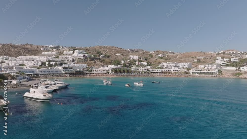 Aerial video of the coastline with hotels and yachts moored off the coast of Mykonos Aerial video of the coastline with hotels and yachts moored off the coast of Mykonos