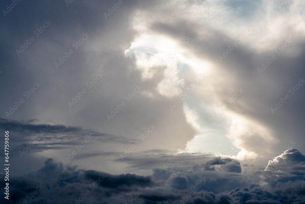 Fototapeta premium Dramatic sky with grey clouds over the city before the storm. Weather before or after a storm.