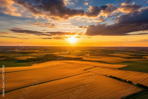 A picturesque sunset over a golden field of crops