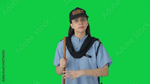 Angry Indian female security guard shouting on someone Green screen photo