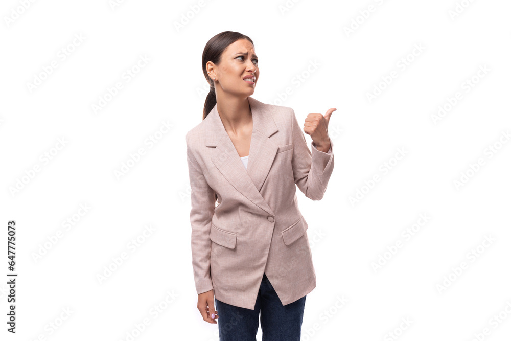 portrait of a young slender brunette business woman with ponytail dressed in a jacket and jeans portrait of a young slender brunette business woman with ponytail dressed in a jacket and jeans