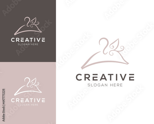 Combination of hanger and abstract leaves logo design vector illustration