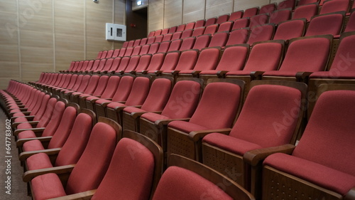 Seats of the auditorium. Concert hall equipment, spectator seats without people.