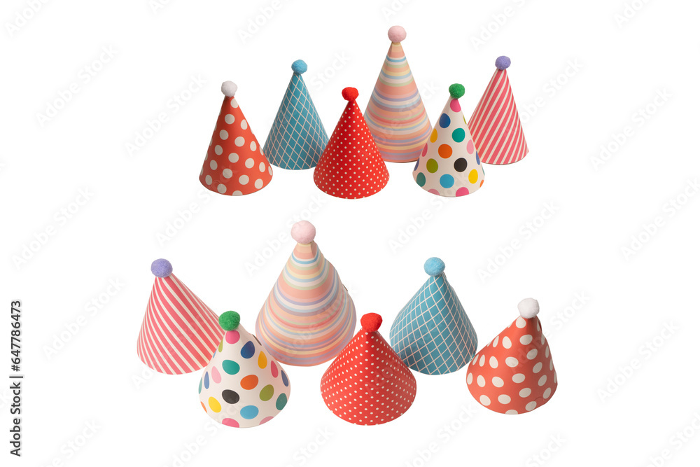 A group of bright and colorful birthday caps isolated on a white background. A group of bright and colorful birthday caps isolated on a white background.