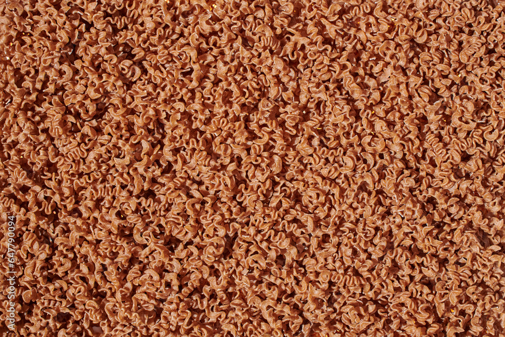 Brown pasta fusilli noodle abstract background Brown pasta fusilli noodle abstract background