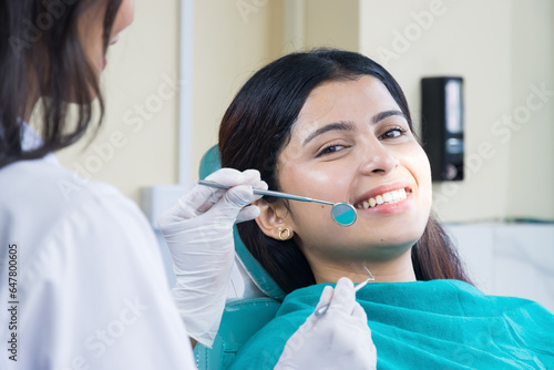 Asian Dentist Checking up on her patient  Female dentist and Female Patient in a Hospital
