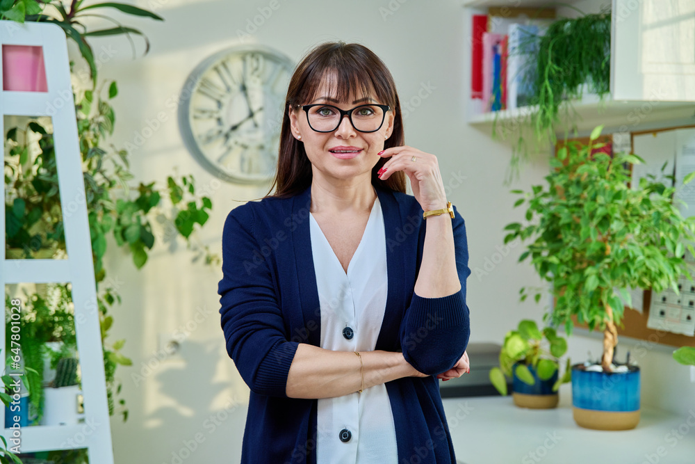 Portrait of confident middle-aged woman in office Portrait of confident middle-aged woman in office