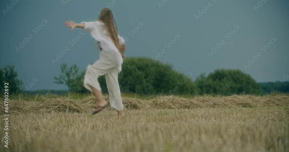 Happy Young Woman Running On Grass In Field Happy Young Woman Running On Grass In Field