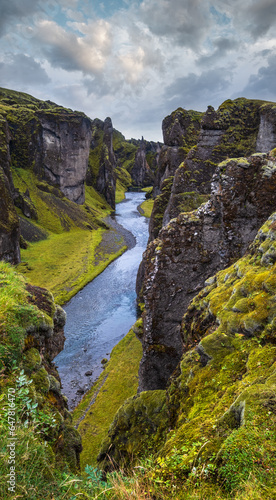 Fjadra river flowing through beautiful Fjadrargljufur canyon. Southern Iceland. Autumn overcast day. It is located near the Ring Road, not far from the village of Kirkjuaejarklaustur.