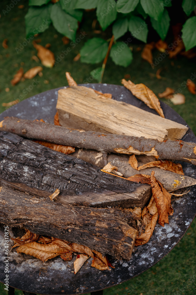 Logs, natural wood texture. A pile of chopped logs of firewood for the fire. Ancients prepared for barbecue Logs, natural wood texture. A pile of chopped logs of firewood for the fire. Ancients prepared for barbecue