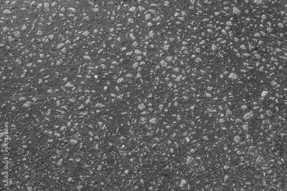 Asphalt background texture with grain pebble. Top view. Close-up.