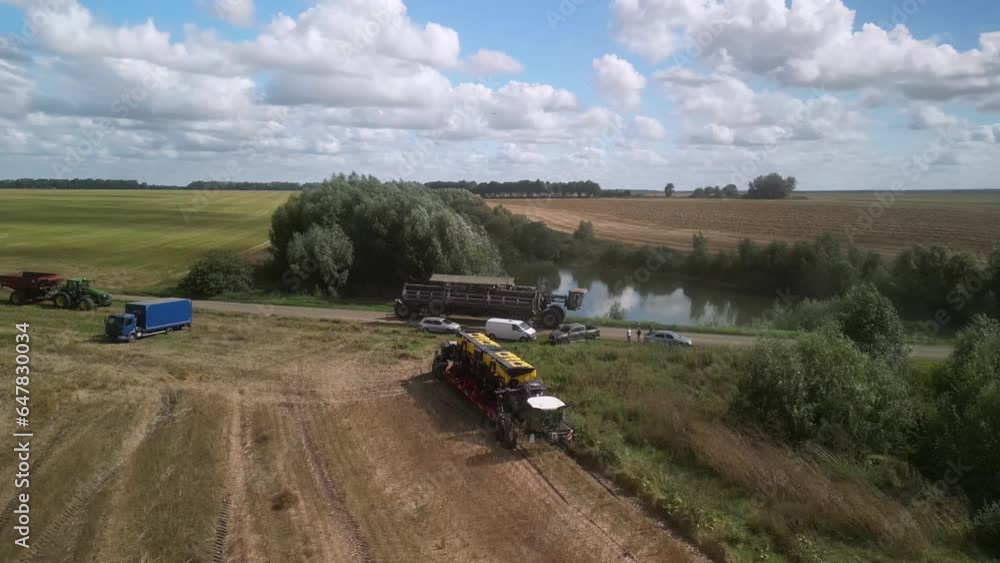 Modern Combine Harvester at canola harvest in Ukraine Modern Combine Harvester at canola harvest in Ukraine