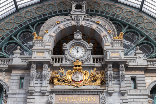 Hall with clock and sign with the Dutch city name Antwerpen in the city of Antwerp in Belgium.